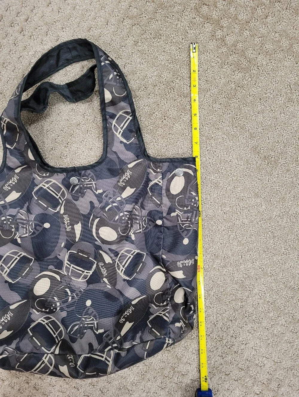 Double handle bag, snap closure, flat bottom, football pattern, like new